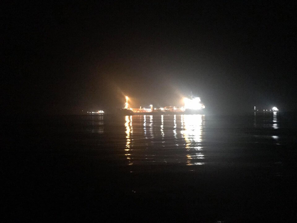 Anchored ships helping to guide the way
